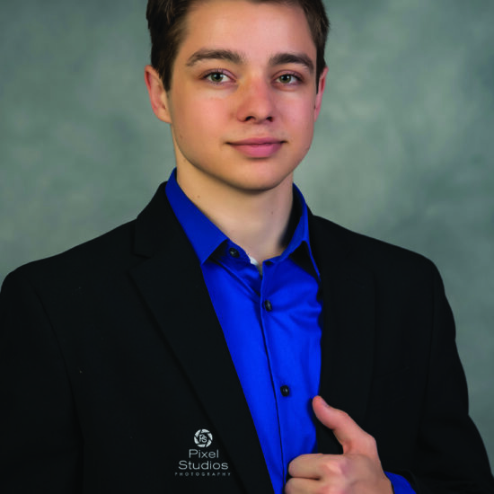 professional business headshot photo of young man smiling