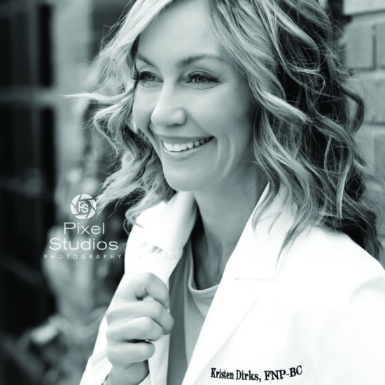 black and white professional business headshot photo of woman doctor smiling