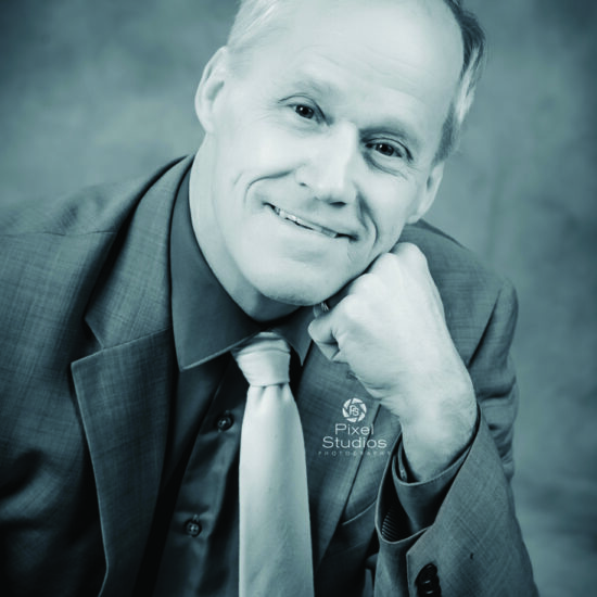 headshot black and white business photo man smiling