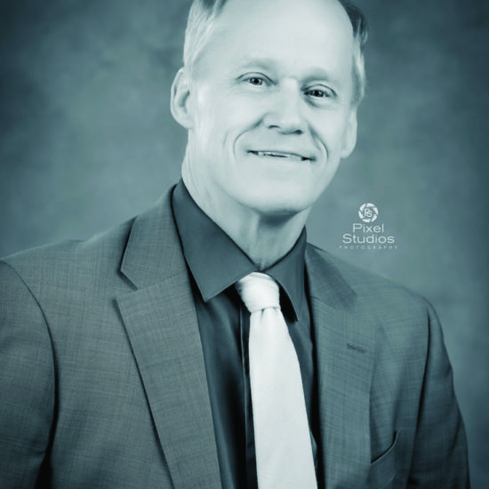 headshot black and white business photo man smiling