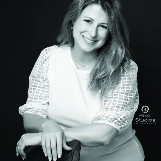 black and white professional business headshot photo of woman smiling