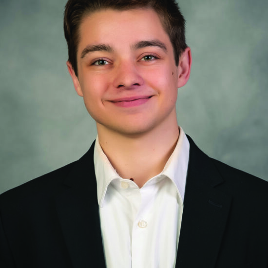 professional business headshot photo of young man smiling