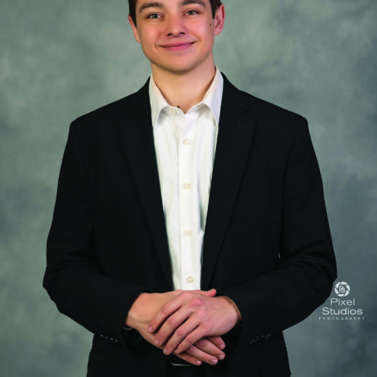 professional business headshot photo of young man smiling