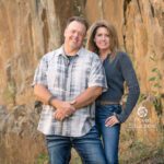 Couple posing in front of a really beautiful tan rock wall. Epic image Black Hills Photographer Laurel Danley