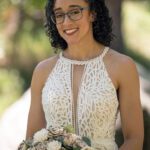 A bridal portrait with the brides wooden flowers and her detailed thick lace dress. Outdoor image in Custer State Park.